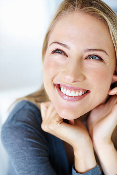 istock Happy young woman smiling 184625499