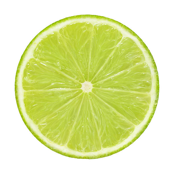 sección transversal de limón sobre fondo blanco - limones verdes fotografías e imágenes de stock