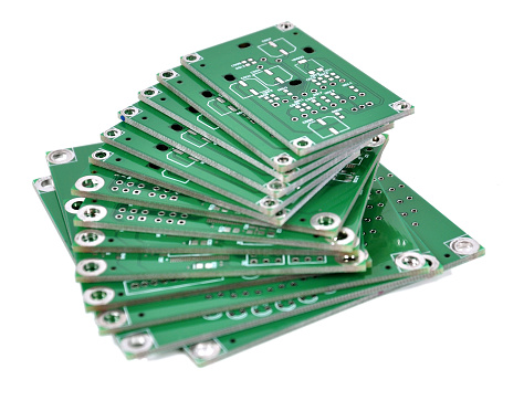 A stack of PCBs isolated on white. Shot with a Nikon D90 camera with a shallow DOF. 