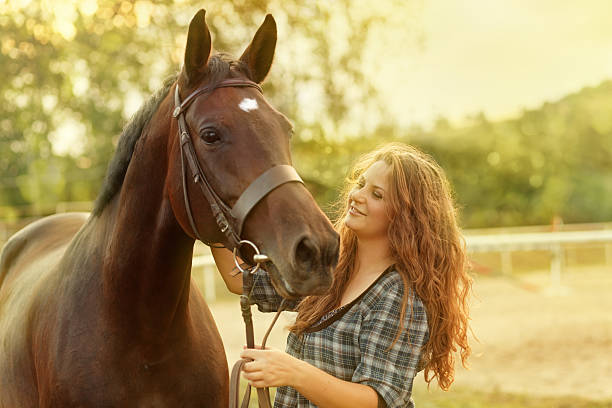 istock woman together with her horse 184626274
