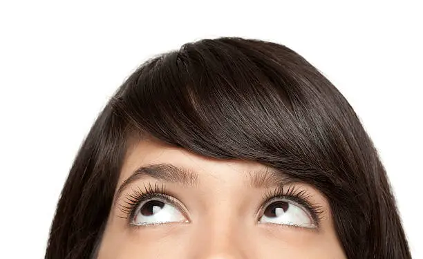 Photo of Young woman looking up