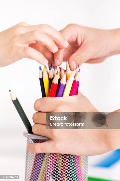 Childrens Hands Arranging Or Picking Up Drawing Pencils Stock Photo - Download Image Now