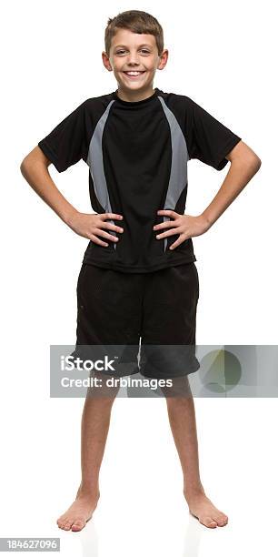 Happy Boy With Arms Akimbo Stock Photo - Download Image Now - Boys, Short Sleeved, Shorts