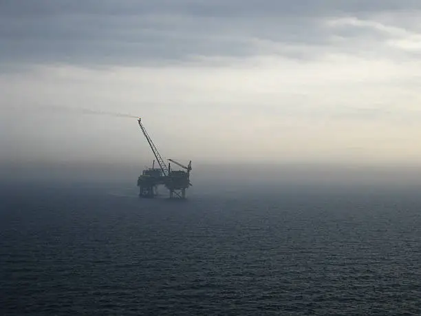 "An oilrig, production platform at dawn on a grey misty morning in the north seamore images at:"