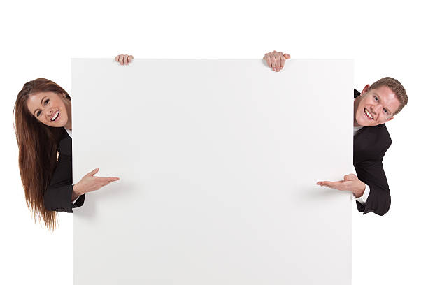 istock Business couple showing a placard 184627535
