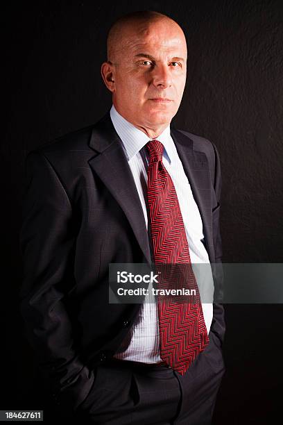 Businessman Standing Against Black Background Stock Photo - Download Image Now - 50-54 Years, 50-59 Years, Active Seniors