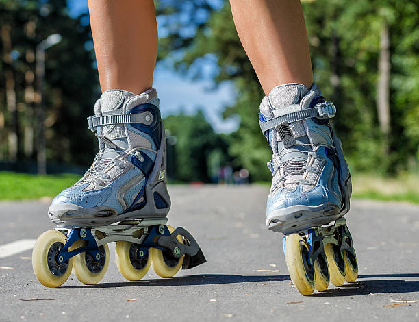 istock Close-up view of female legs in roller blades 184630862