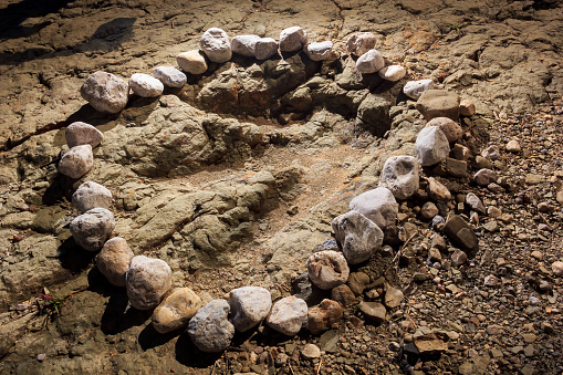 In the petrified bed of a river in San Juan Raya, within the Tehuacan-Cuicatlan Biosphere Reserve, state of Puebla, the petrified footprints of dinosaurs that lived here in the Jurassic were found, specifically these of carnivorous theropods. They are marked with river stones to be able to identify them.