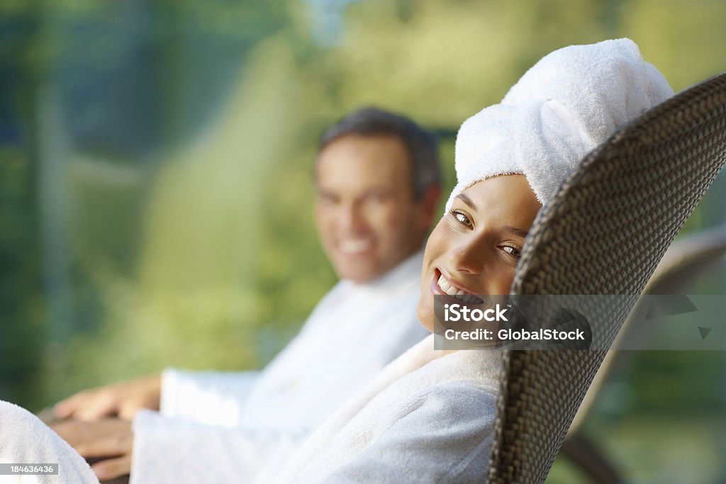 Smiling couple in bathrobes Portrait of caring couple in bathrobes smiling outdoors Happiness Stock Photo