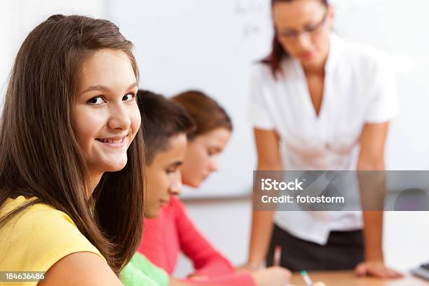 Smiling Teenage Girl In The Classroom Stock Photo - Download Image Now - Adult, Assistance, Back to School