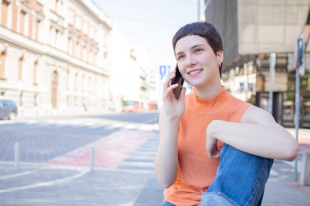 istock Happy young woman using phone 1846367645