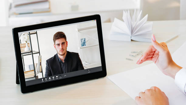 istock Internet conference video man tablet woman hands 1846367698