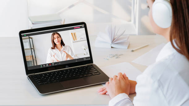 istock Online learning video tutor woman laptop workplace 1846367721