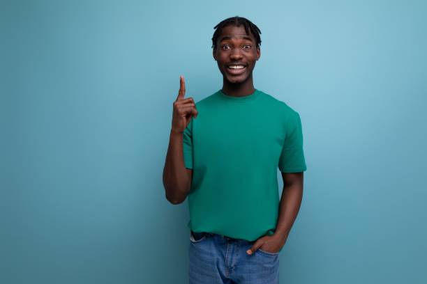 istock authentic ethnic african young man with dreadlocks in a casual t-shirt on a background with copy space 1846367882