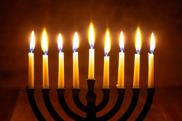 istock Hanukkah Menorah Candle on a retro wood background 1846368415
