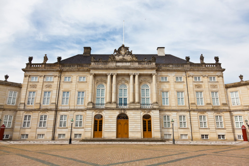 Copenhagen, Denmark - May 29, 2023: Amalienborg Palace in central Copenhagen consists of four mansions, two of which are home to the queen and the crown prince