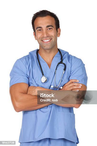 Male Doctor Standing With His Arms Crossed Stock Photo - Download Image Now - 20-29 Years, Adult, Adults Only