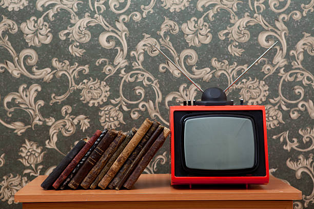 istock Books leaning on old fashioned tv 184637189