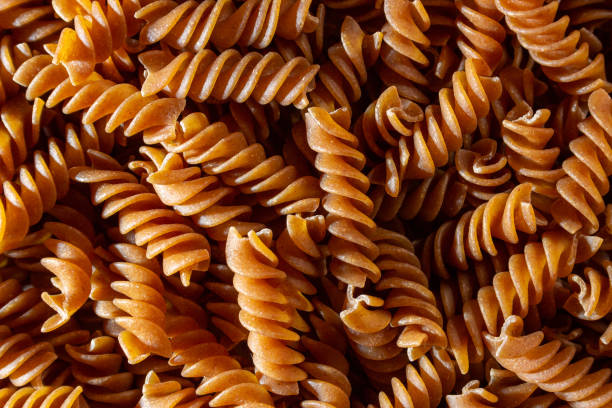 istock Uncooked Whole Grain Fusilli Pasta Background 1846372174