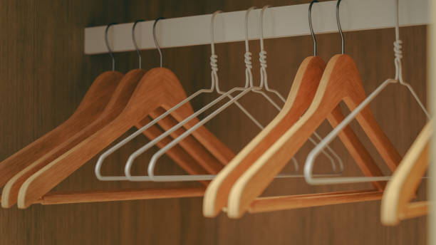 istock several empty hangers hanging in the empty closet for organizing the closet, 3d rendering 1846375717