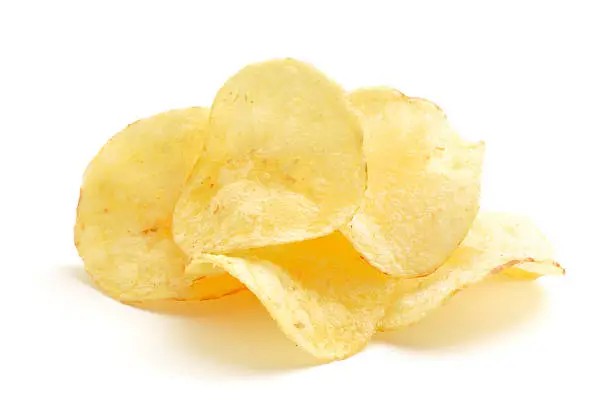 Crisps in a small pile isolated on a white background.