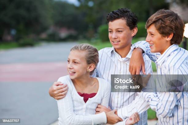 Three Siblings Standing Outdoors Stock Photo - Download Image Now - 10-11 Years, 14-15 Years, Adolescence