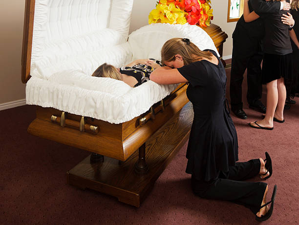istock Grieving Young Woman at a Funeral 184637818