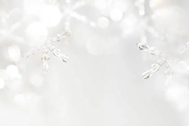Hand made snowflakes , selective focus, high key photo. The snowflakes are designed and crafted by me.  