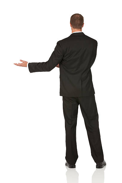 istock Rear view of a businessman gesturing 184637879