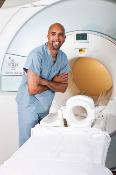 istock Healthcare worker preparing CT scanner 184637991