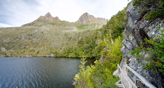 The hiking trail that encircles picturesque Dove Lake in Cradle Mountain-Lake Saint Clair National Park.  Cradle Mountain-Lake Saint Clair National Park is located in northern Tasmania.