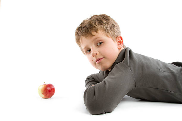 young boy young boy on white backgroundsee my healthy eating red above studio shot stock pictures, royalty-free photos & images