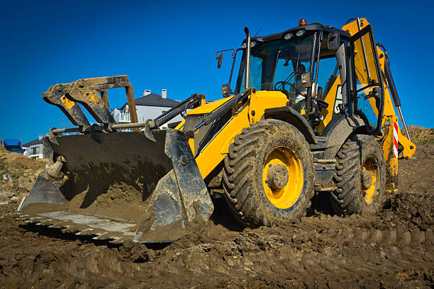 istock Earth mover working in a new road construction 184638323