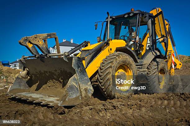 Earth Mover Working In A New Road Construction Stock Photo - Download Image Now - Bulldozer, Front View, Backhoe