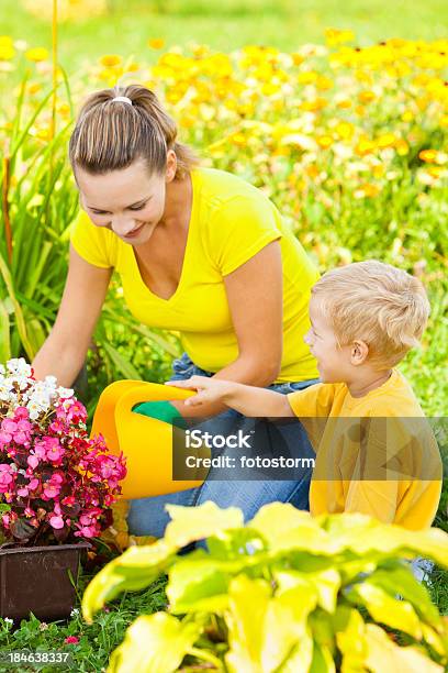 Mother And Son Gardening Stock Photo - Download Image Now - Adult, Agriculture, Assistance