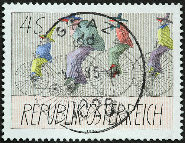 istock vintage large wheeled bicycle on an old Swiss stamp 184638362