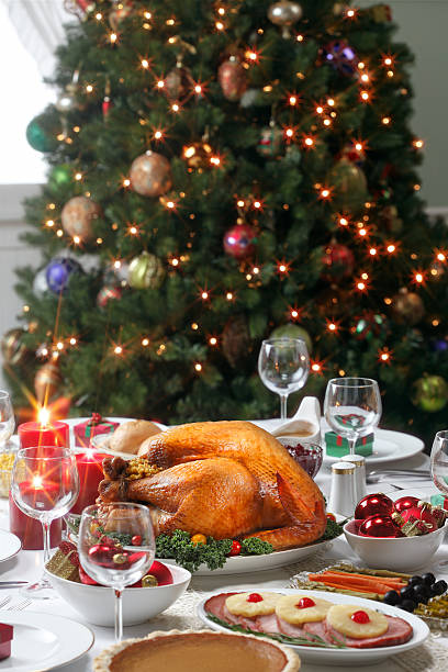 istock Christmas dinner with a Christmas tree in the background 184638943