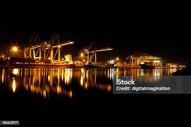 Loading And Unloading Of Cargo Ships Stock Photo - Download Image Now - Blue, Business, Cargo Container