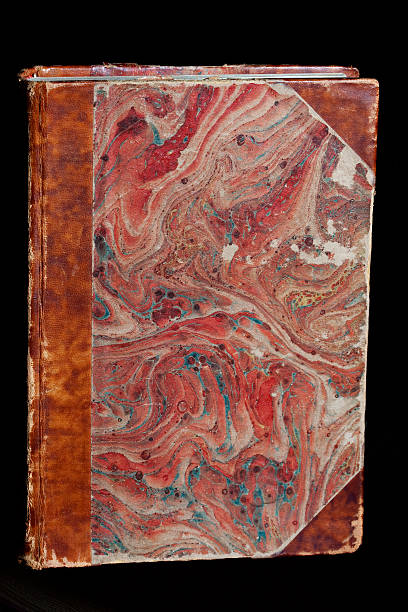 istock Antique Marbled Book on a Black Background 184639224