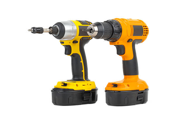 istock pair of power tools in yellow and orange 184639597