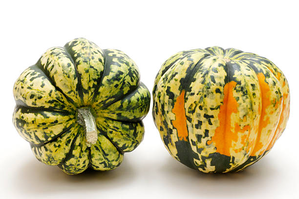 istock Green and yellow squash on white background. 184639600