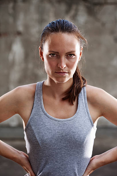 istock Intense young woman after working out 184639657