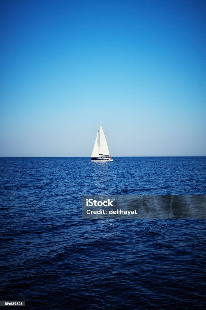 Sailboat Single sailboat on the horizon Adventure Stock Photo