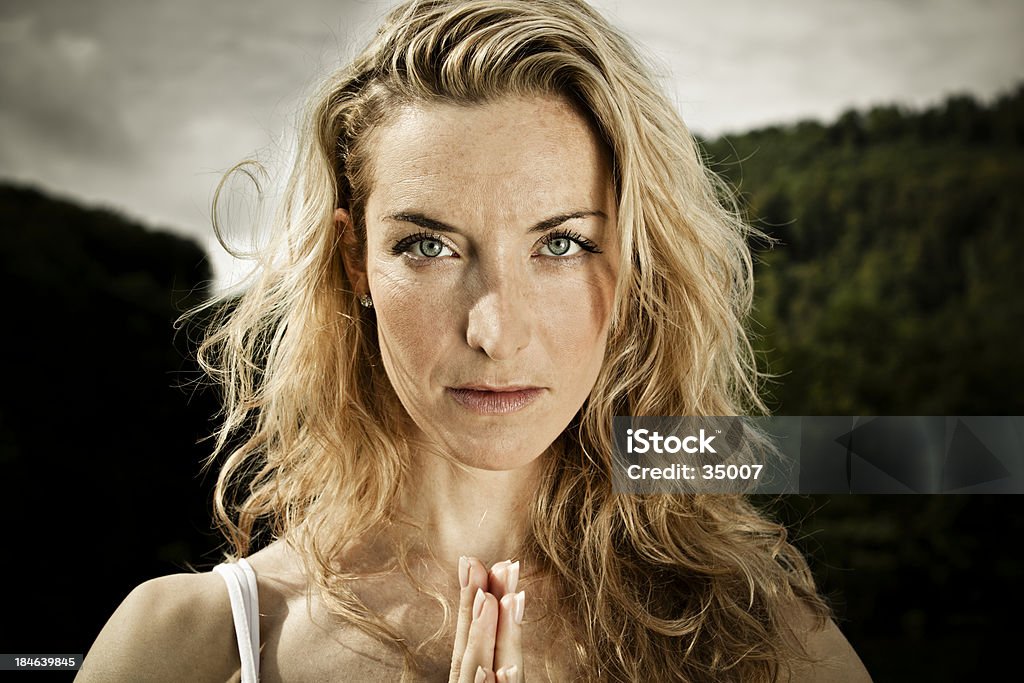 namaste portrait attractive woman meditating with hands joined. Adult Stock Photo