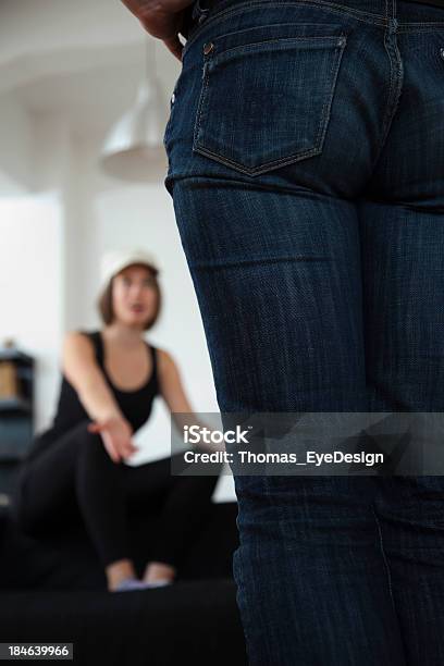 Gay Couple Sitting On Couch Having A Heated Argument Stock Photo - Download Image Now