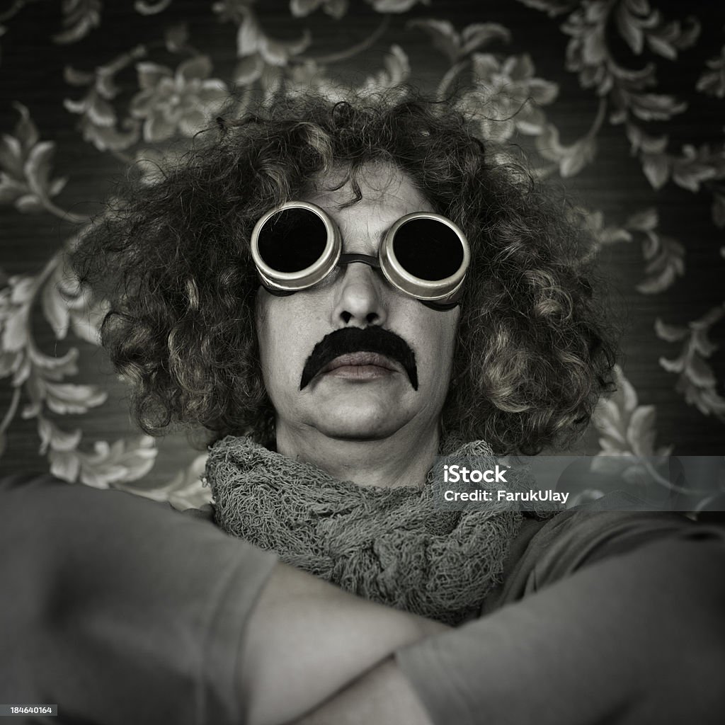 Wonder Woman Portrait of an adult woman with curly hair, with a fake Pancho Villa moustache and brass goggles. Pancho Villa Stock Photo