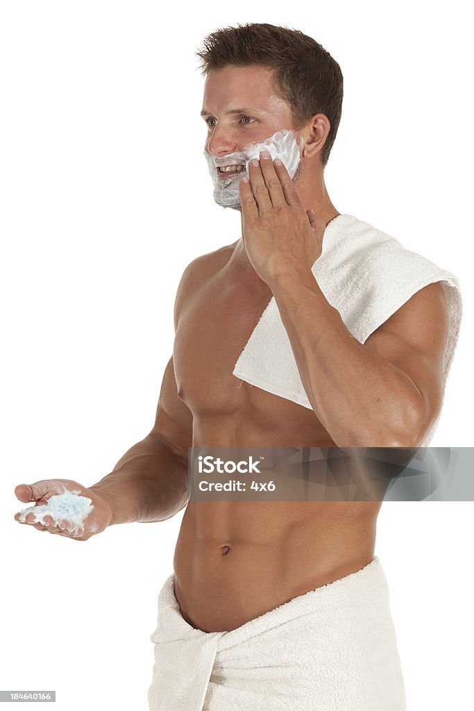 Attractive young man applying shaving cream to face Attractive young man applying shaving cream to facehttp://www.twodozendesign.info/i/1.png 20-29 Years Stock Photo