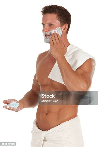 Attractive Young Man Applying Shaving Cream To Face Stock Photo - Download Image Now