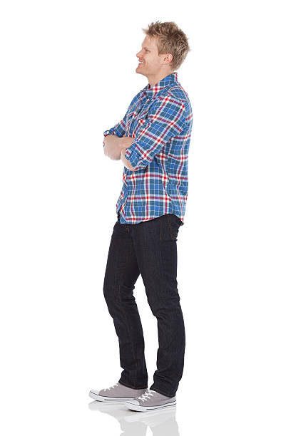 Man standing with his arms crossed Man standing with his arms crossedhttp://www.twodozendesign.info/i/1.png man standing profile stock pictures, royalty-free photos & images