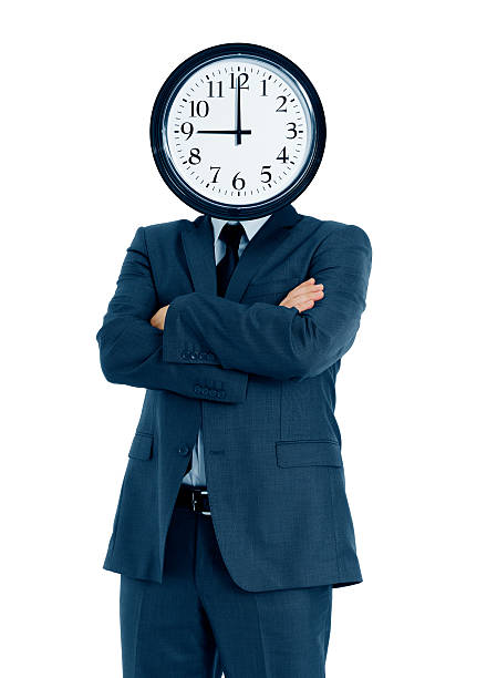istock Businessman holding clock in front of his head 184641566